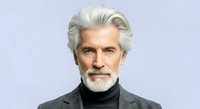 Mature man with silver hair and beard wearing dark turtleneck and blazer against neutral background. Suitable for business, corporate, professional, and lifestyle editorial use.