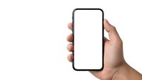 Hand holding modern smartphone with blank white screen isolated on white background for mobile app presentation and digital technology mockup.