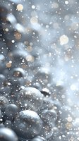Magical winter background with silver Christmas balls covered in snow and sparkling bokeh lights creating dreamy festive atmosphere.