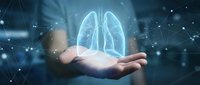 Digital holographic lungs floating above open palm with network connections for healthcare technology and medical innovation concepts.