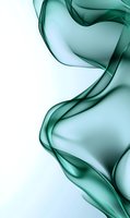 Flowing emerald green smoke creates elegant curves and waves against white background, suggesting movement and fluidity. Suitable for luxury branding and abstract designs.
