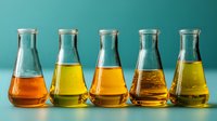 Row of laboratory conical flasks with colorful liquids in yellow and orange hues against turquoise background, useful for science or chemistry concepts.