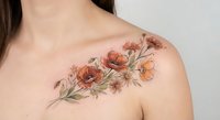Young woman with delicate floral tattoo on shoulder featuring orange poppies and botanical elements in watercolor style for body art and tattoo design concepts.