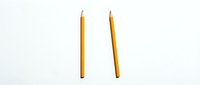 Two yellow wooden pencils isolated on white background for educational and office supplies design projects.