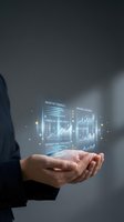 Businessman hands displaying holographic financial data dashboard with charts and graphs for business analytics and digital transformation.