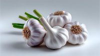 Fresh whole garlic bulbs with green stems on white background, dramatic studio lighting creates soft shadows highlighting natural texture and form.