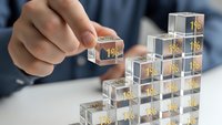 Business professional building percentage blocks representing growth strategy and financial planning for investment success.