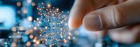 Futuristic microchip technology concept with glowing circuit paths and finger touching digital network connection on blue background with bokeh light effects.