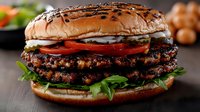 Gourmet double beef patty burger with melted cheese, fresh tomato slices, crisp lettuce, and sesame seed bun. Perfect for restaurant menus, food blogs, and culinary marketing.