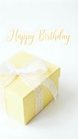 Yellow gift box with lace bow and golden Happy Birthday script on white background, perfect for greeting cards and celebration designs.