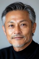 Confident mature Asian male executive with silver hair and gentle smile wearing black turtleneck against neutral background, professional headshot style portrait.
