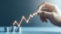 Glowing financial growth chart rising from stacked coins with hand pointing, representing investment success and market performance analysis on blue background.