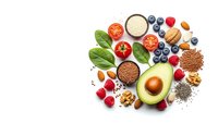 Healthy superfood ingredients avocado berries nuts seeds vegetables grains arranged on white background for nutritious meal planning and diet concepts.