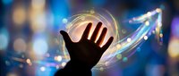 Human hand reaching toward glowing digital growth arrow with light effects and bokeh background representing business success and future opportunities.