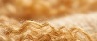 Luxurious golden blonde hair strands with soft natural waves and warm sunlight creating beautiful highlights and depth for beauty and haircare concepts.