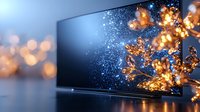 Modern flat screen television displaying magical glowing particles and golden bokeh lights against dark background, creating atmospheric holiday ambiance.