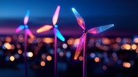 Colorful wind turbines with neon illumination against blurred city lights background at dusk, representing sustainable energy and modern urban development.