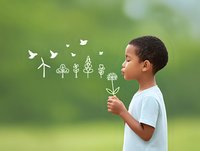 Young African American boy blowing dandelion with illustrated birds and trees appearing from his breath against blurred green background. Environmental education concept.