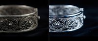 Ornate silver bracelet with intricate floral engravings showcased in dramatic lighting, perfect for luxury jewelry advertising and elegant fashion campaigns.