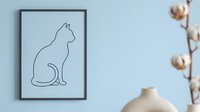 Minimalist line art cat silhouette in black frame on light blue wall with cotton branch and ceramic vase for modern home decor and interior design.