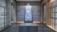 Holographic female mannequin display in modern luxury retail showroom with glass cases and contemporary lighting for fashion presentation.