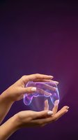 Hands protecting transparent gaming controller with purple glow on gradient background for technology and digital entertainment concepts.