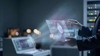 Businessman analyzing financial data on transparent tablet with holographic interface in modern office environment for business technology presentations.