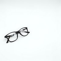 Black-framed eyeglasses on clean white background, isolated for design use in optical, healthcare, and fashion projects.