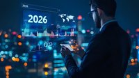 Businessman analyzing 2026 financial data on futuristic holographic display with world map and charts against blurred city lights background.