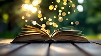 Open book with glowing magical lights and bokeh effect floating above pages against dark green nature background, creating mystical reading atmosphere.