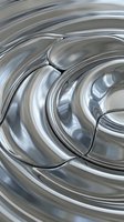 Liquid metal swirls with flowing curves and reflective surfaces creating an abstract, modern composition with smooth wave patterns.