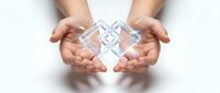 Hands protecting geometric crystal structure with holographic light effects on white background for business and technology concepts.