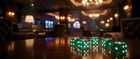 Green luminous dice on reflective surface in upscale casino interior with warm ambient lighting, chandeliers, and blurred gaming tables for gambling and entertainment concepts.