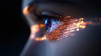 Macro shot of eye with digital fiber optic light effects and glowing particles, representing vision technology, artificial intelligence and future innovations.