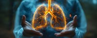 Glowing orange human lungs floating between hands against dark background, medical concept showing respiratory system and pulmonary health visualization.