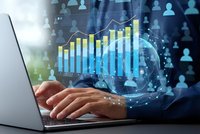 Business professional analyzing financial growth data on laptop with holographic charts and global network connections for corporate strategy planning.