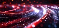 Glowing red and blue light trails curve through dark space creating dynamic motion effect with bokeh particles and streaks for technology backgrounds.