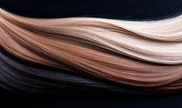 Smooth flowing strands of blonde and brunette hair with gradient color transition on black background, showcasing natural hair movement and shine.