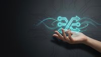 Digital technology innovation concept with human hand holding glowing circuit board and data flow symbols representing artificial intelligence, connectivity, and modern computing solutions.