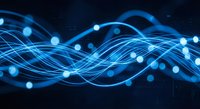 Abstract blue energy waves with glowing particles flowing on dark background for technology and digital communication concepts.