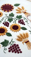 Autumn harvest embroidery featuring sunflowers, wheat bundles and grape vines on white fabric. Traditional needlework with seasonal motifs for fall crafts.