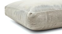 Beige linen throw pillow with visible stitching detail, soft textured fabric cushion for home decor, interior design, and furniture styling concepts.