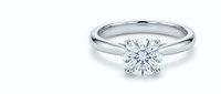 Classic solitaire diamond engagement ring with brilliant cut stone on white gold band isolated on white background for jewelry design and wedding concepts.
