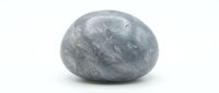 Blue calcite crystal stone isolated on white background for healing meditation and spiritual energy practices.
