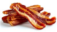 Crispy fried bacon strips stacked on white background, showing layers of fat and meat with golden-brown edges and rich red coloring.