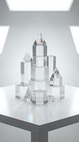Crystal castle towers with blue and gold accents arranged on white surface in minimalist studio setting with soft lighting, suitable for luxury branding and award concepts.
