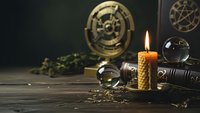 Mystical occult scene with burning candle, compass, magnifying glass and ancient symbols on dark wooden table for esoteric ritual practices.