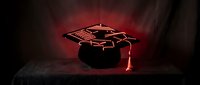 Glowing red neon graduation cap outline on dark background with dramatic lighting effects for education and achievement concepts.