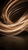 Dynamic golden light trails swirling in spiral motion creating abstract energy vortex on dark background for modern digital design projects.