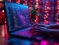 Software developer coding on laptop with colorful bokeh lights creating atmospheric programming workspace for tech projects and digital innovation.